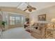 Bright living room with vaulted ceiling, comfy seating, and large windows at 328 Eden Dr, Englewood, FL 34223