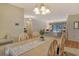 Light and airy dining room with table, chairs, and view to living room at 328 Eden Dr, Englewood, FL 34223