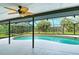 Relaxing kidney-shaped pool with screened enclosure at 328 Eden Dr, Englewood, FL 34223