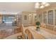 Dining room with light wood table and chairs, open to living room at 328 Eden Dr, Englewood, FL 34223
