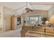 Living room with bay window, sectional sofa, and built-in cabinet at 328 Eden Dr, Englewood, FL 34223