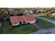 Aerial view of single-Gathering home with tile roof and large yard at 328 Eden Dr, Englewood, FL 34223