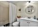 Bathroom with tub shower, toilet, and white vanity at 275 Mission W Trl # H, Venice, FL 34285