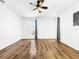 Bright bedroom with hardwood floors and a ceiling fan at 107 Los Cedros Dr, Anna Maria, FL 34216