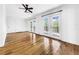 Spacious bedroom with hardwood floors and access to deck at 107 Los Cedros Dr, Anna Maria, FL 34216