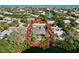 Aerial view of waterfront home with large deck at 107 Los Cedros Dr, Anna Maria, FL 34216