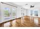 Bright living room with hardwood floors and access to deck at 107 Los Cedros Dr, Anna Maria, FL 34216