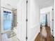 Bathroom with tub and access to bedroom at 107 Los Cedros Dr, Anna Maria, FL 34216