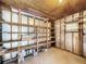 Unfinished basement with ample shelving for storage at 107 Los Cedros Dr, Anna Maria, FL 34216