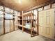 Unfinished basement with shelving and storage space at 107 Los Cedros Dr, Anna Maria, FL 34216