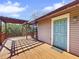 Elevated deck with pergola, offering access to home's exterior at 107 Los Cedros Dr, Anna Maria, FL 34216