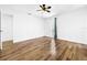 Hardwood floors and large windows in this bright bedroom at 107 Los Cedros Dr, Anna Maria, FL 34216
