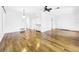 Bright dining room with hardwood floors and kitchen access at 107 Los Cedros Dr, Anna Maria, FL 34216