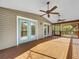 Spacious screened porch with ceiling fans at 107 Los Cedros Dr, Anna Maria, FL 34216