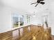 Bright dining room with hardwood floors and access to multiple rooms at 107 Los Cedros Dr, Anna Maria, FL 34216
