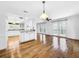Bright white kitchen with hardwood floors at 107 Los Cedros Dr, Anna Maria, FL 34216