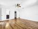 Spacious bedroom with hardwood floors and walk-in closet at 107 Los Cedros Dr, Anna Maria, FL 34216