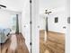 Bright bedroom with hardwood floors and two windows at 107 Los Cedros Dr, Anna Maria, FL 34216