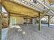 Elevated home with ground level entrance and parking under the house at 107 Los Cedros Dr, Anna Maria, FL 34216