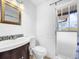 Small bathroom with updated vanity and tile at 107 Los Cedros Dr, Anna Maria, FL 34216