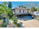Elevated beach home with parking underneath and a small balcony at 107 Los Cedros Dr, Anna Maria, FL 34216