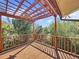 Elevated deck with pergola offering scenic views of the water at 107 Los Cedros Dr, Anna Maria, FL 34216