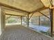 Covered patio area under the house with tiled flooring and gravel at 107 Los Cedros Dr, Anna Maria, FL 34216