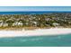 Elevated view of beachfront home showcasing its unique architecture at 104 Sunset Ln, Holmes Beach, FL 34217