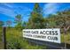 Sign indicating private gate access to the country club at 34452 Singletary Rd, Myakka City, FL 34251