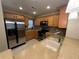 Modern kitchen with stainless steel appliances and light wood cabinets at 8807 White Sage Loop # 1903, Lakewood Ranch, FL 34202