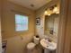 Clean and simple bathroom with white vanity and toilet at 8807 White Sage Loop # 1903, Lakewood Ranch, FL 34202