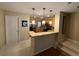 Modern kitchen with stainless steel appliances and light wood cabinets at 8807 White Sage Loop # 1903, Lakewood Ranch, FL 34202