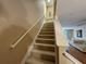 Carpeted staircase leading to upper level at 8807 White Sage Loop # 1903, Lakewood Ranch, FL 34202
