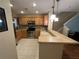Modern kitchen with stainless steel appliances and light wood cabinets at 8807 White Sage Loop # 1903, Lakewood Ranch, FL 34202