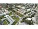 Aerial view of coastal neighborhood featuring beach, condos, and lush landscaping at 705 W Venice Ave # 705-B, Venice, FL 34285