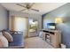 Relaxing sunroom with daybed, sliding glass door to patio, and large TV at 3721 Somerville Dr # 1513, Sarasota, FL 34232