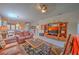 Comfortable living room with leather sofas and a large entertainment center at 8146 Stirling Falls Cir, Sarasota, FL 34243