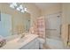 Small bathroom with shower/tub combo and marble countertop at 8146 Stirling Falls Cir, Sarasota, FL 34243