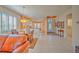 Open kitchen with breakfast bar, tile floors, and white cabinets at 8146 Stirling Falls Cir, Sarasota, FL 34243