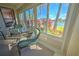Enclosed patio with lake and garden views at 8146 Stirling Falls Cir, Sarasota, FL 34243