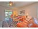 Relaxing living room featuring leather sofas and access to a screened lanai at 8146 Stirling Falls Cir, Sarasota, FL 34243