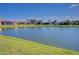 Serene lake view from the backyard, perfect for relaxation at 8146 Stirling Falls Cir, Sarasota, FL 34243