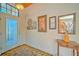 Bright and spacious entryway with decorative wall art and a cozy rug at 8146 Stirling Falls Cir, Sarasota, FL 34243