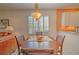 Casual dining area with wood table and chairs near kitchen at 8146 Stirling Falls Cir, Sarasota, FL 34243