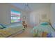 Guest bedroom with two twin beds and a ceiling fan at 8146 Stirling Falls Cir, Sarasota, FL 34243