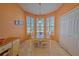 Charming breakfast nook with a wooden table and access to the kitchen at 8146 Stirling Falls Cir, Sarasota, FL 34243
