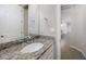 Powder room with granite countertop and single sink at 2275 Hamburg Ln, Punta Gorda, FL 33983
