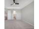 Bright bedroom with ceiling fan and plush carpeting at 2275 Hamburg Ln, Punta Gorda, FL 33983