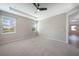 Spacious bedroom with two windows and ceiling fan at 2275 Hamburg Ln, Punta Gorda, FL 33983