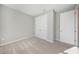 Bright bedroom with double door closet and carpeting at 2275 Hamburg Ln, Punta Gorda, FL 33983
